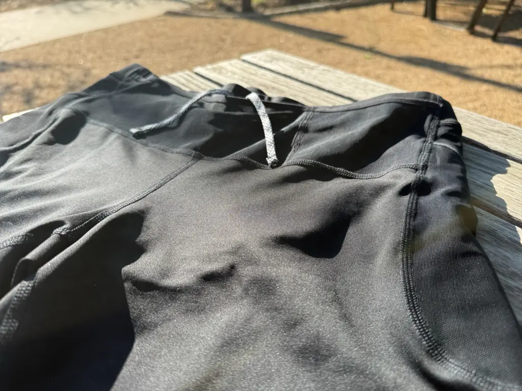 An angled view of the front of the half tights, showing the three front pockets in more detail