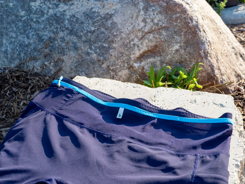 A view of the wide, open-top storage section on the front of the waistband