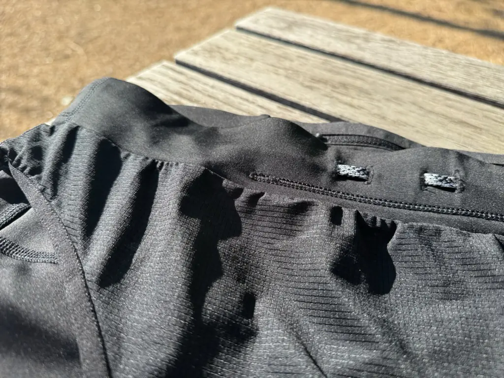 A close up shot of the waistband, showing the simple construction and the internal/external drawstring routing holes