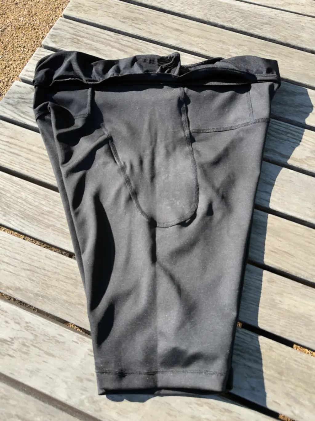 A top down view of the inside of the side of the half tights, showing the seam construction of the side pockets