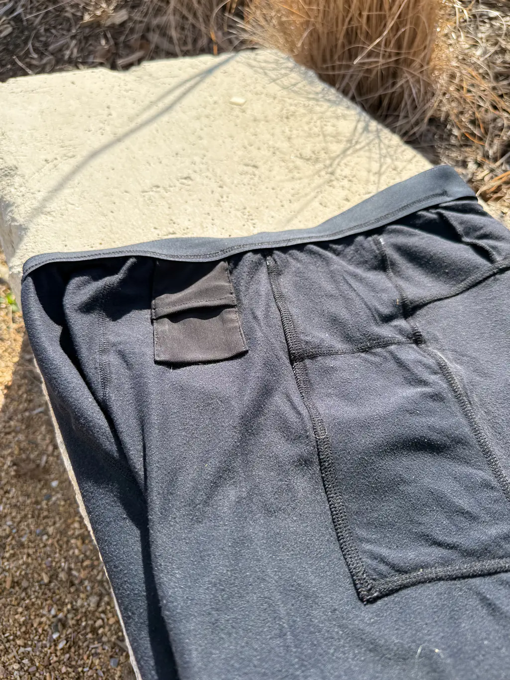A shot of the pocket construction on the interior of the half tights, showing the flat seams as well as the small key pocket on the waistband