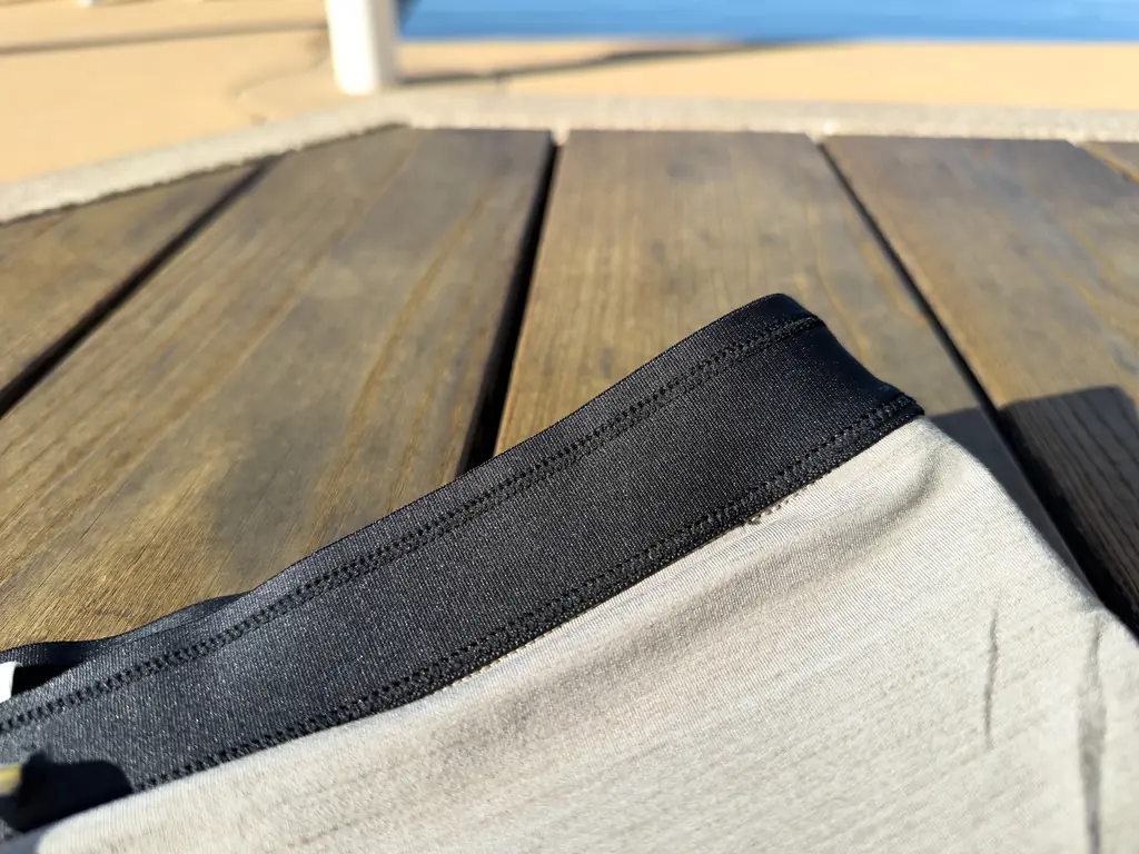 A closeup of the interior of the waistband, showing how the slightly stiffer waistband fabric joins to the liner.