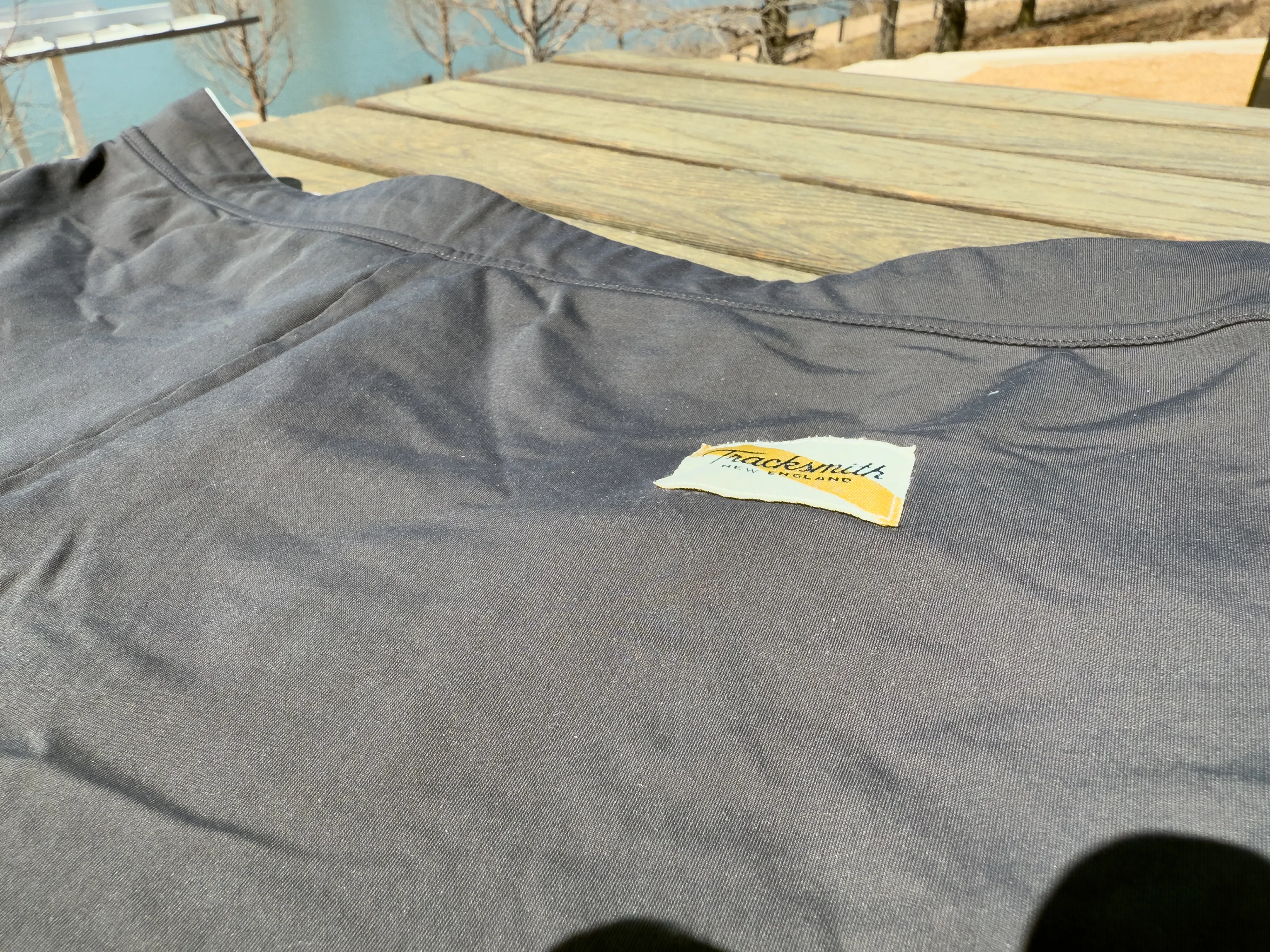 A closeup of the Tracksmith label, including the signature sash