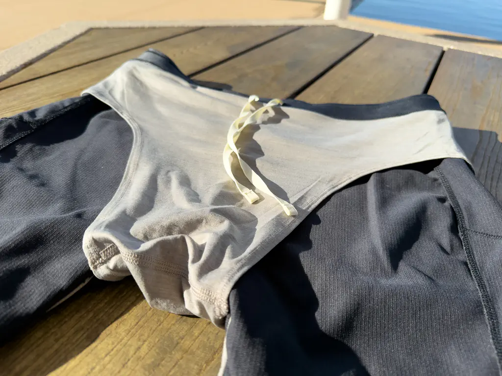 A view of the brief liner of the half tights, made of a softer, off-white fabric.