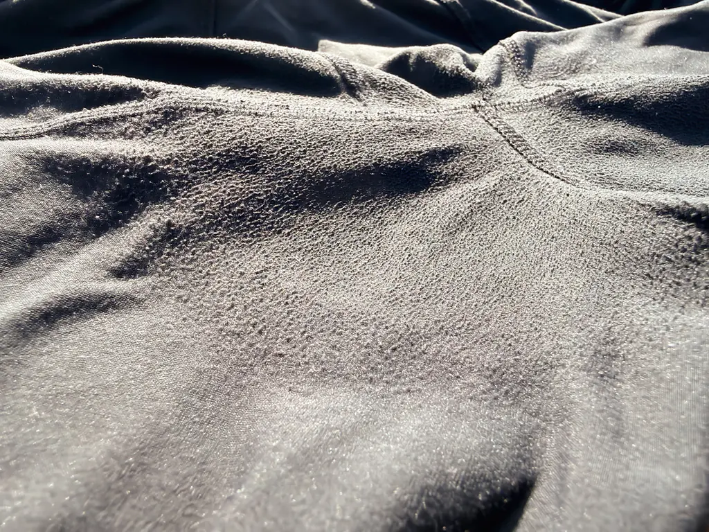 A closeup of the pilling, showing how the fabric is almost harder or solidified in this area