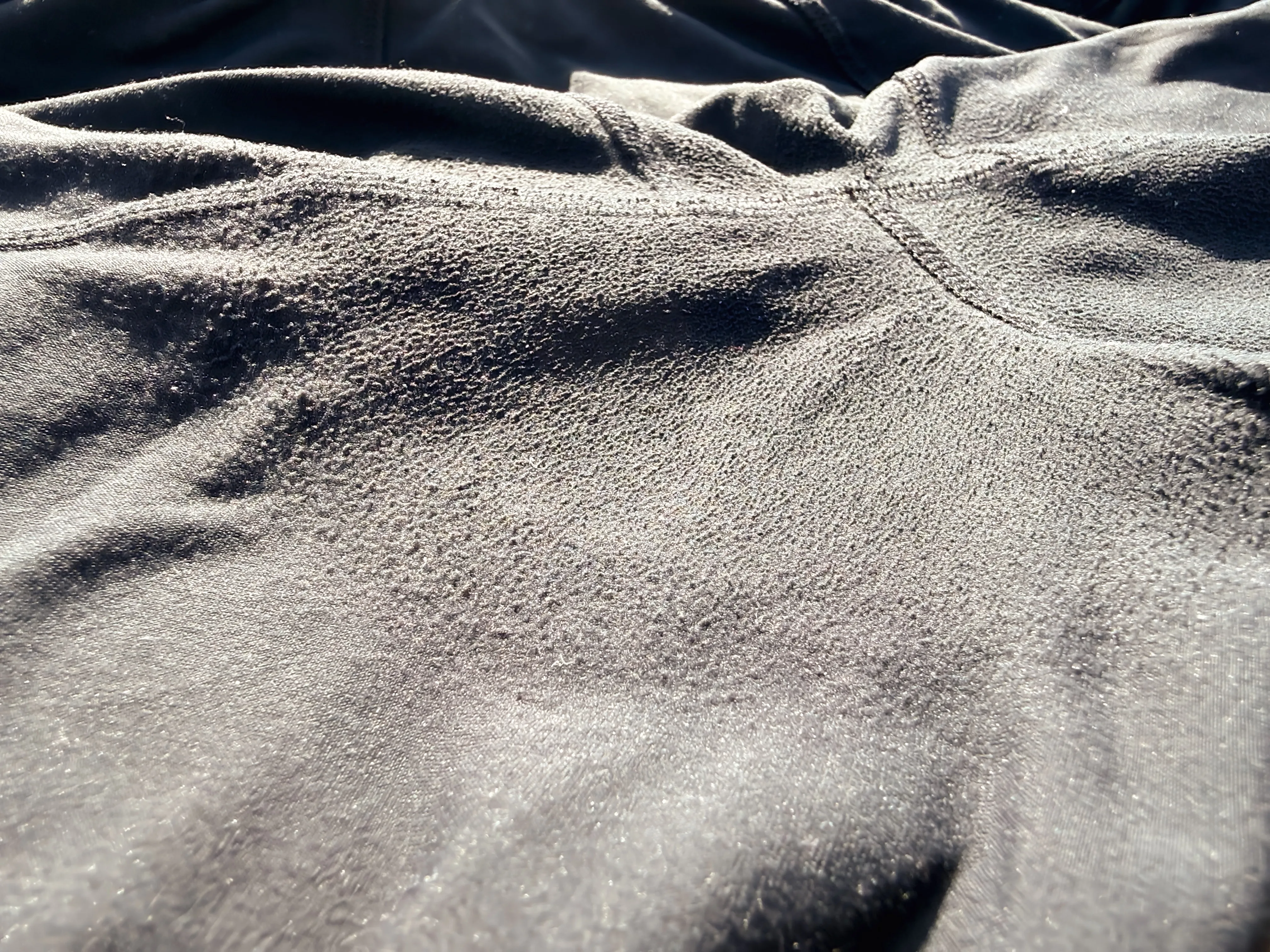 A closeup of the pilling, showing how the fabric is almost harder or solidified in this area