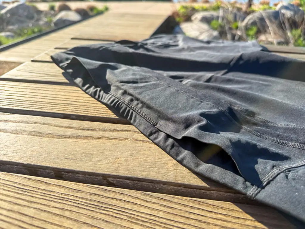 A view of the rear pocket openings, showing the large, deep pass through pocket.
