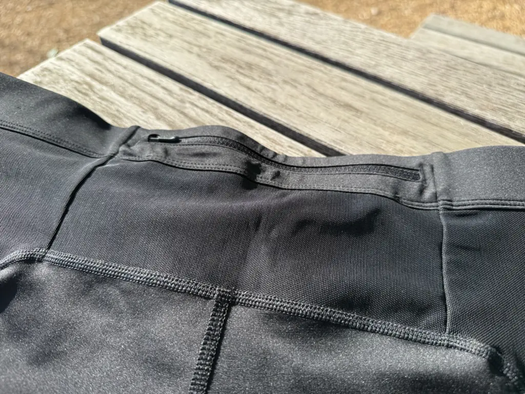 A close up of the rear zipper pocket