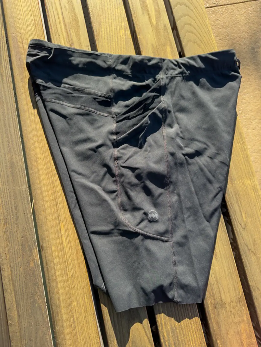 A view of the side of the half tights, showing the two stacked pockets (empty)
