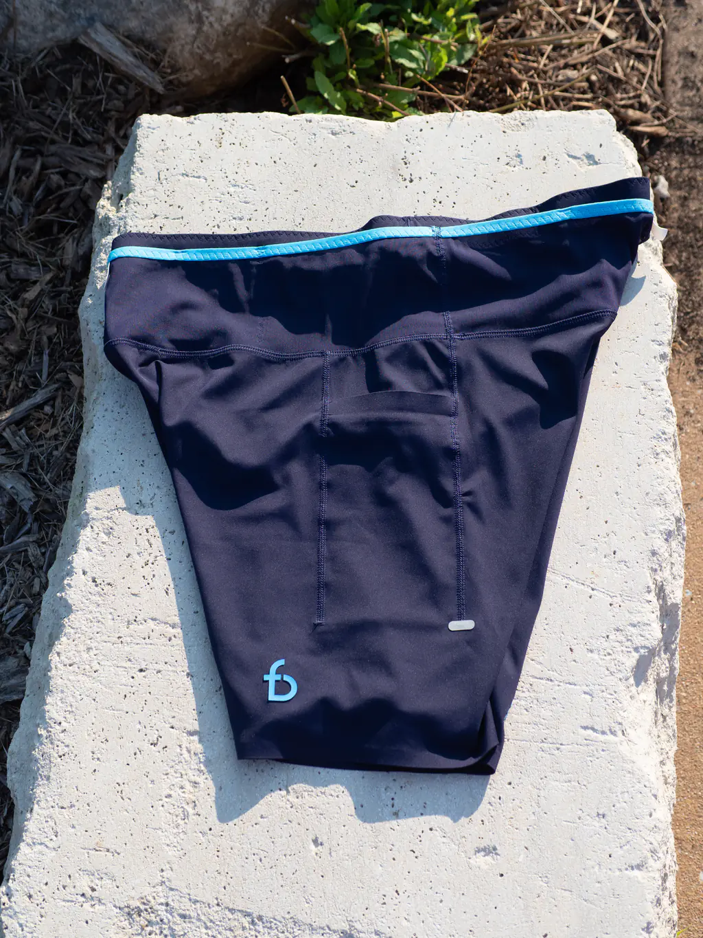 A top down view of the side of the half tights, showing the inset thigh pocket