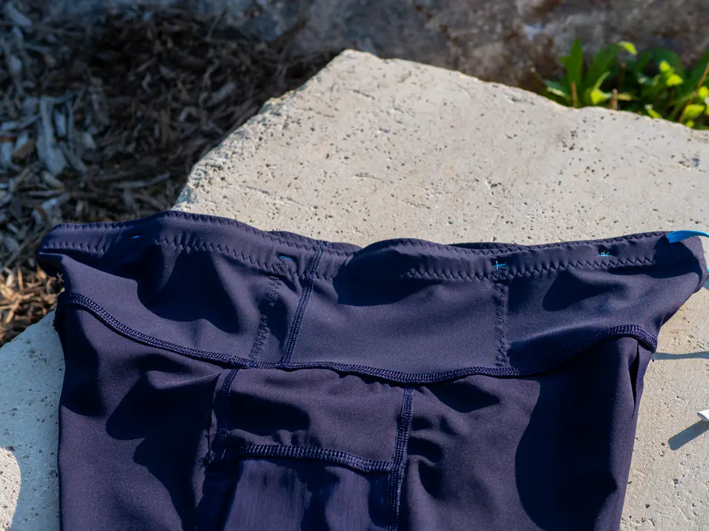 An inside view of the waistband storage, showing the stitching that holds the elastic in place